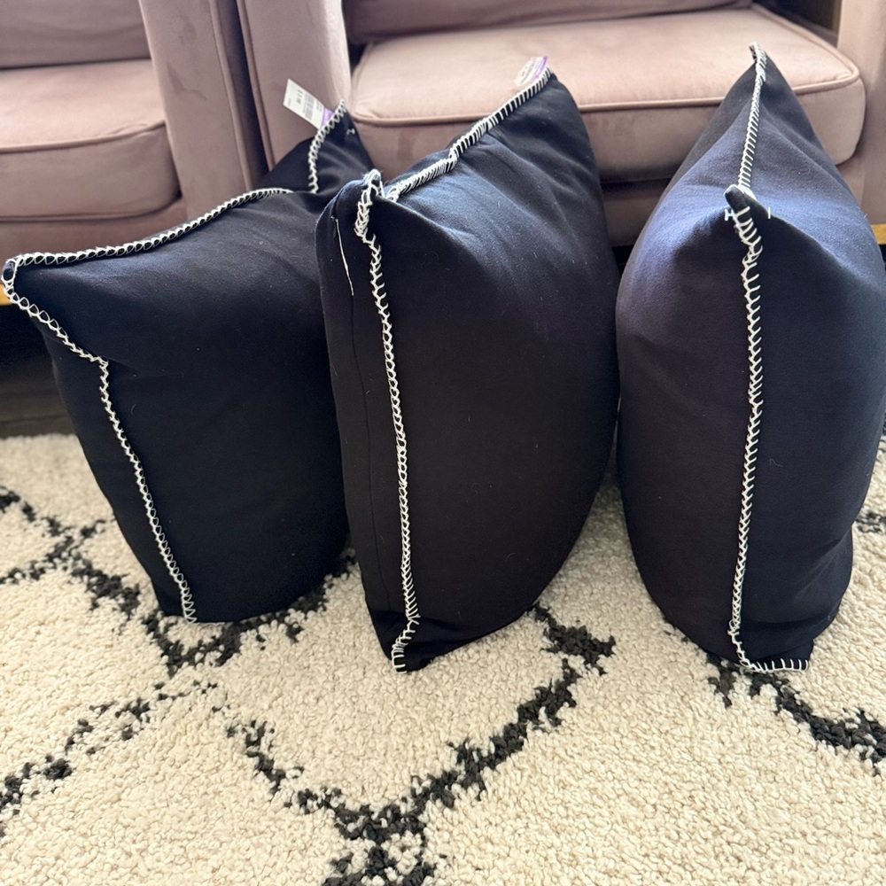 Elegant Black Throw Pillows with White Stitching